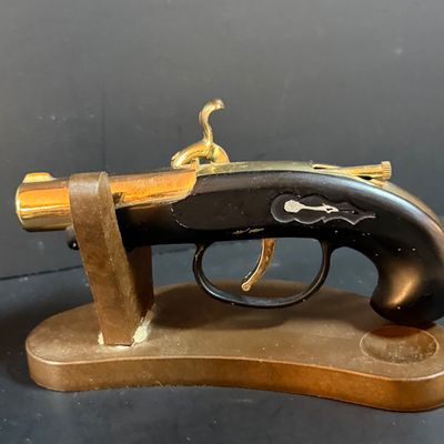 LOT 251: Collection of Desk Lighters Featuring an Antique Cherub Music Box Ligher and More