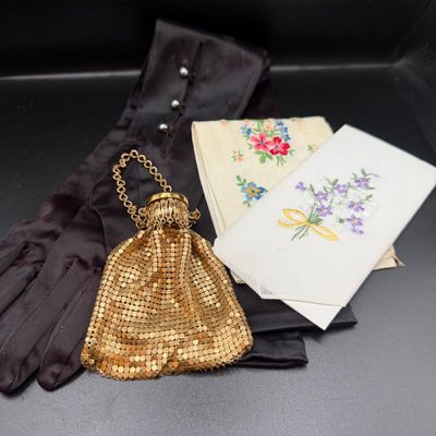 LOT 253: Antique Whiting and Davis Goldtone Metal Mesh Ring Purse, Antique Black Satin Opera Gloves and Embroidered Handkerchiefs