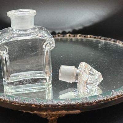 LOT 254: Mirrored Vanity Tray with Perfume Bottles Including Jordache Perfume by Armani and Guerlain Baccarat Bottle and More
