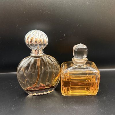 LOT 258: Collection of Designer Perfume and Perfume Bottles Including Givenchy, Guerlain and More