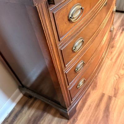 LOT 182: Bowed Front Chest of Drawers with Pull-Out Slide and Oval Hardware and Removable Glass Top