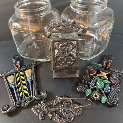 LOT 1: Vintage Large Wide Mouth Glass Jars, Cast Iron Match Dispenser, Cast Iron Pennsylvania Dutch Style Trivets and Cast Iron Hook