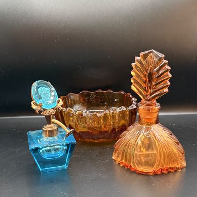 LOT 255: Amber Glass Perfume Bottler with Feather Fan Stopper, Blue Glass Cameo Perfume Atomizer and Amber Glass Bowl
