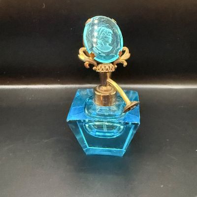 LOT 255: Amber Glass Perfume Bottler with Feather Fan Stopper, Blue Glass Cameo Perfume Atomizer and Amber Glass Bowl