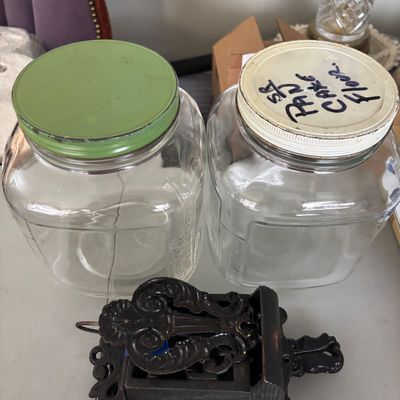LOT 1: Vintage Large Wide Mouth Glass Jars, Cast Iron Match Dispenser, Cast Iron Pennsylvania Dutch Style Trivets and Cast Iron Hook