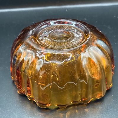 LOT 255: Amber Glass Perfume Bottler with Feather Fan Stopper, Blue Glass Cameo Perfume Atomizer and Amber Glass Bowl