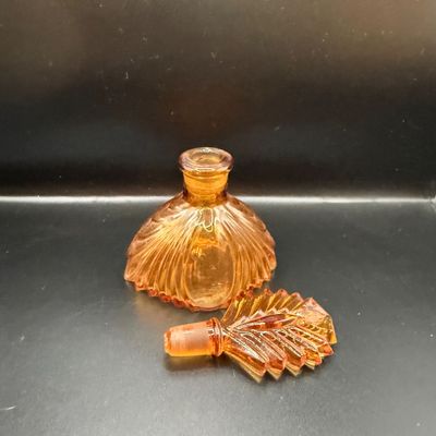 LOT 255: Amber Glass Perfume Bottler with Feather Fan Stopper, Blue Glass Cameo Perfume Atomizer and Amber Glass Bowl