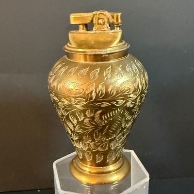 LOT 251: Collection of Desk Lighters Featuring an Antique Cherub Music Box Ligher and More