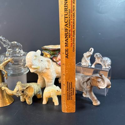 LOT 249: Elephant Collection Including a Planter, Figurines, Glass Trinket Box and a Giraffe Brass Bell