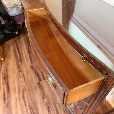 LOT 182: Bowed Front Chest of Drawers with Pull-Out Slide and Oval Hardware and Removable Glass Top