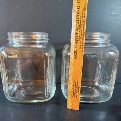 LOT 1: Vintage Large Wide Mouth Glass Jars, Cast Iron Match Dispenser, Cast Iron Pennsylvania Dutch Style Trivets and Cast Iron Hook