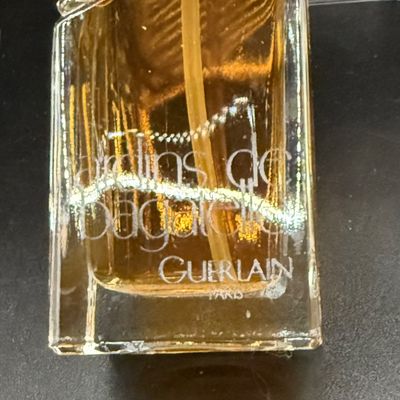 LOT 258: Collection of Designer Perfume and Perfume Bottles Including Givenchy, Guerlain and More