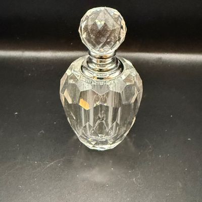 LOT 257: Collection of Cut Crystal Perfume Bottles by Oleg Cassini and More