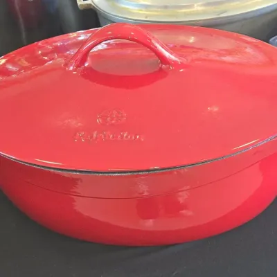 Sale Photo Thumbnail #350: Calphalon enamel on cast iron oval dutch oven red
