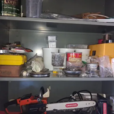 Sale Photo Thumbnail #533: Vintage chainsaw and workshop storage assortment