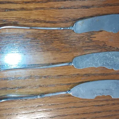 Sale Photo Thumbnail #108: Vintage silver plated butter spreaders with twisted handles