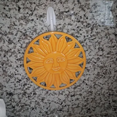 Sale Photo Thumbnail #92: Vintage ceramic sun face trivet