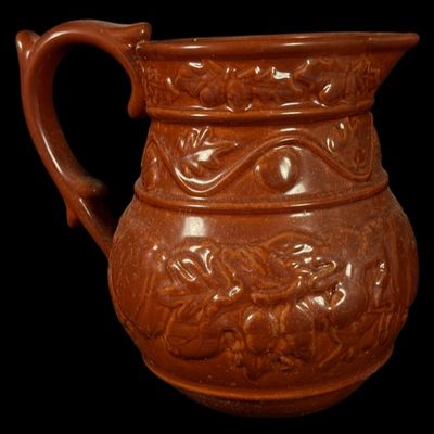 Sale Photo Thumbnail #126: Relief-Molded Brown Stoneware Pitcher