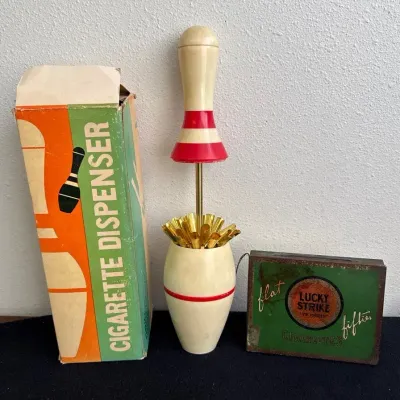 Vintage Bowling Pin Cigarette Dispenser & Lucky Strike Tin