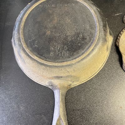 Sale Photo Thumbnail #112: Cast iron pan and trivet