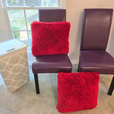 Purple Vinyl Side Chairs, Red Pillows, Laundry Basket
