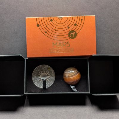 Sale Photo Thumbnail #380: Limited Edition HIGH RELIEF Antique Finish Solar System 2 Oz. .999 FINE SILVER 2024 Republic of Ghana 10 Cedis Mars (Shield & Spear of the God of War) Round in Display Box w/ COA - Includes Carnelian Crystal Sphere (Planet Replica)