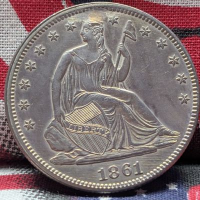 Sale Photo Thumbnail #300: 1861 w/ Drapery Seated Liberty 90% Silver Half Dollar w/ Repaired Plugged - UNC