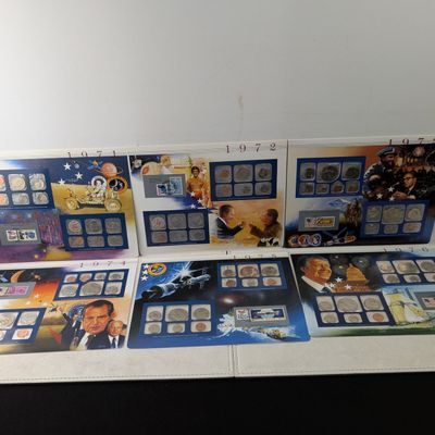 Sale Photo Thumbnail #408: 1971-1976 P&D U.S. Mint UNC Sets in Display w/ Commem Stamps (6 Sets)