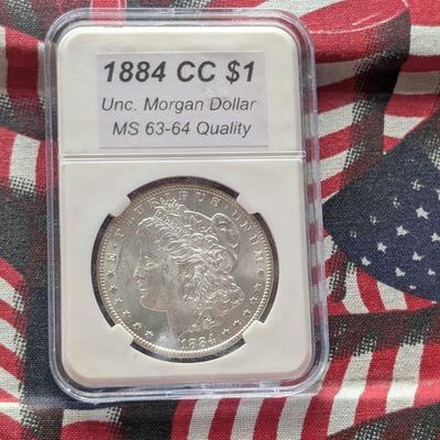 Sale Photo Thumbnail #414: 1884-CC Morgan 90% Silver Dollar - Slabbed MS63-64