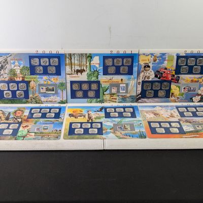 Sale Photo Thumbnail #443: 2000, 2001, 2002, 2003, 2005 and 2006-P&D U.S. Mint UNC Statehood Quarter Sets in Display w/ Commem Stamps (6 Sets) - ONLY QUARTERS