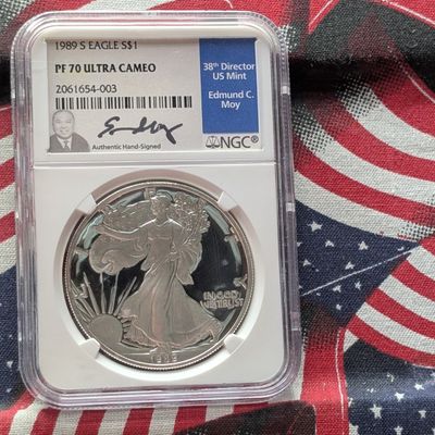Sale Photo Thumbnail #430: 1989-S PROOF American Silver Eagle - NGC PF70 ULTRA CAMEO w/ Edmund C. Moy's Signature Case, .999 Fine Silver One Troy Ounce