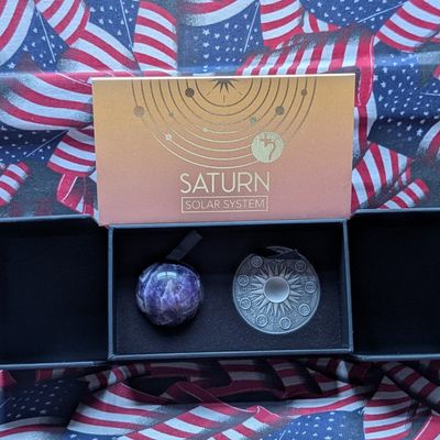 Sale Photo Thumbnail #65: Limited Edition HIGH RELIEF Antique Finish Solar System 2 Oz. .999 FINE SILVER 2025 Republic of Ghana 10 Credis Saturn (Ancient Scythe) Round in Display Box w/ COA - Includes Amethyst Crystal Sphere (Planet Replica)