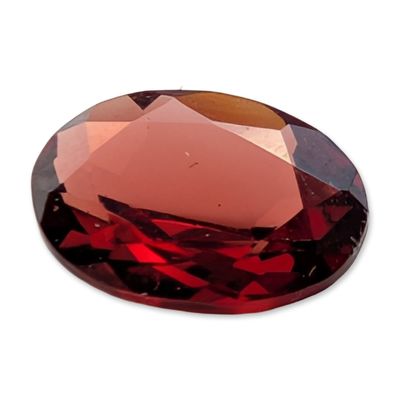 Sale Photo Thumbnail #470: Oval Faceted Reddish-Orange Garnet Gemstone