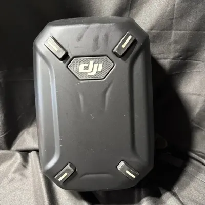 black DJI Hardshell Backpack designed for the Phantom Drone series