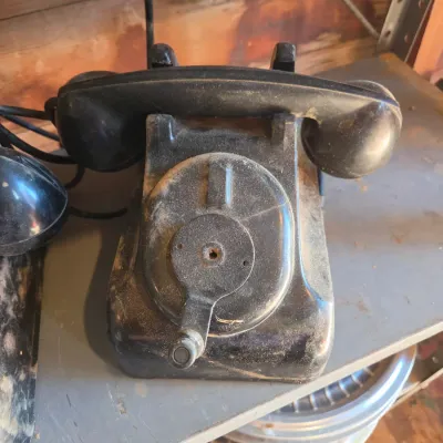 Two Leich Model 901B vintage black Bakelite desk telephones with a hand crank, 1930s or 1940s