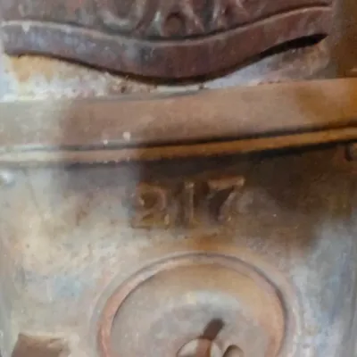 Antique cast-iron "oak-style" pot-belly stove, which reads "BONNY OAK" on the upper front door - appears complete and...