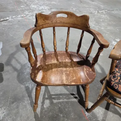 Two vintage wooden colonial-style captain's armchairs