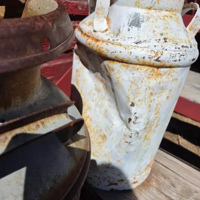 Two vintage & rustic milk cans