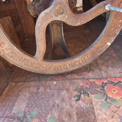Antique Root-Heath Mfg. Co. "Korn King" No. 2 cast iron grist and corn mill, featuring a hand-crank flywheel marked with...