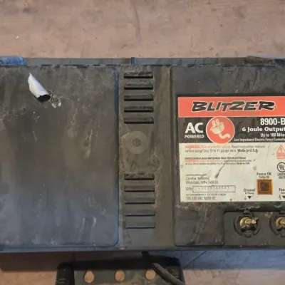 Two electric fence chargers - Blitzer 8900-B and a Hol-Dem model 501