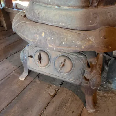 Antique cast-iron "oak-style" pot-belly stove, which reads "BONNY OAK" on the upper front door - appears complete and...