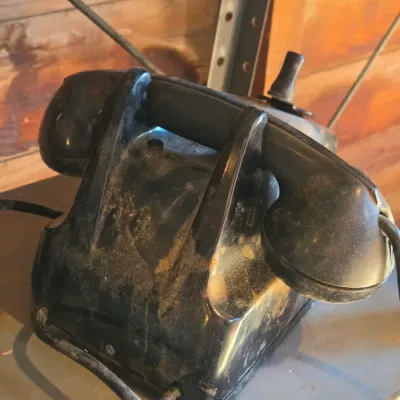 Two Leich Model 901B vintage black Bakelite desk telephones with a hand crank, 1930s or 1940s