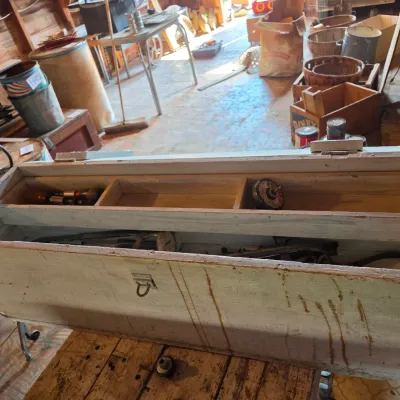 Vintage wood crate toolbox with drawer and an assortment of old tools