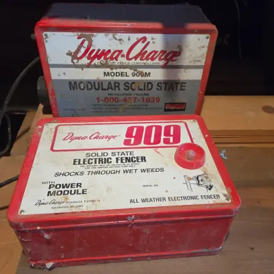 Two Dyna-charge 909 electric fence chargers