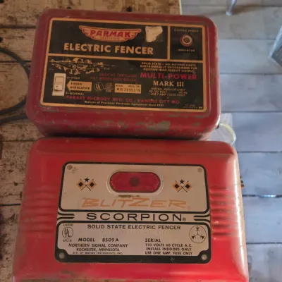 Two electric fence chargers- Paramax Mark III and a Blitzer Scorpion Model 8509 A