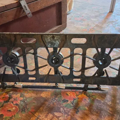 Vintage cast-iron three-burner camp stove with porcelain handles marked 137 on bottom Possibly a Griswold?