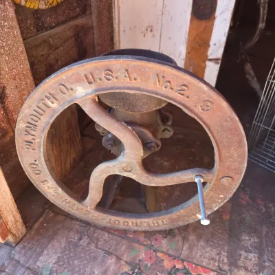 Antique Root-Heath Mfg. Co. "Korn King" No. 2 cast iron grist and corn mill, featuring a hand-crank flywheel marked with...