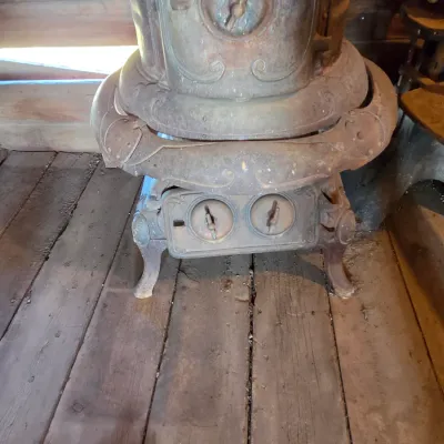 Antique cast-iron "oak-style" pot-belly stove, which reads "BONNY OAK" on the upper front door - appears complete and...