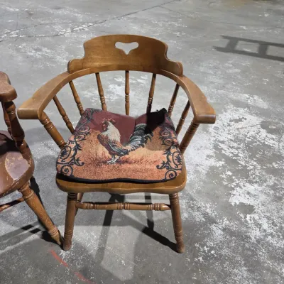 Two vintage wooden colonial-style captain's armchairs