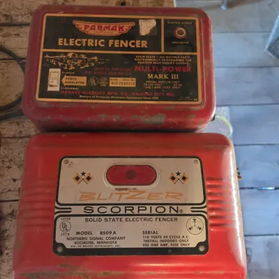 Two electric fence chargers- Paramax Mark III and a Blitzer Scorpion Model 8509 A